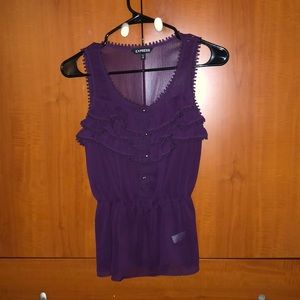 Cute blouse. Silver button detail. Wear to work or dress up in jeans.